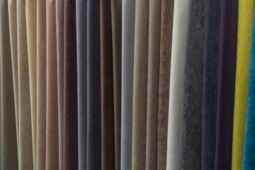 A wide selection of velour and velvet fabrics in the store.