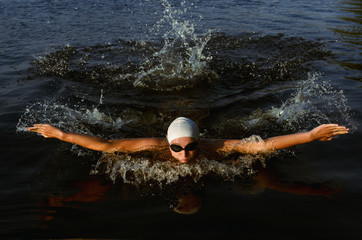 Male athlete wearing a thermal swimsuit. sport swimming in the pool or sea