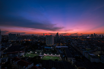 The background of the evening sky with tall buildings, colorful, constantly changing, is a natural beauty.