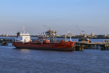 Ship moored near an oil refinery - Humber Estuary - England.