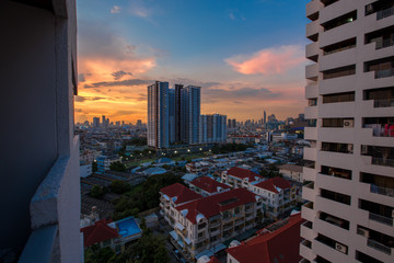The background of the evening sky with tall buildings, colorful, constantly changing, is a natural...