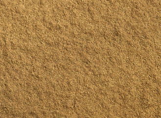Ground cumin texture as background
