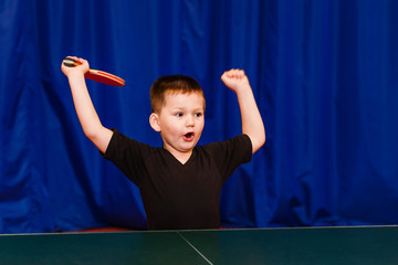 five-year-old boy enjoys victory