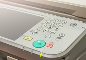 photocopier is a machine that makes paper copies of documents and other visual images ,close-up...