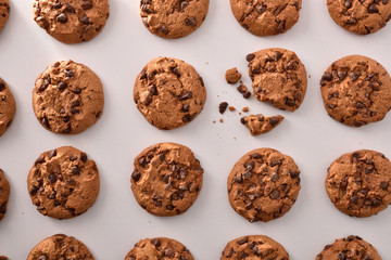 Biscuit pattern with chocolate chips on white table