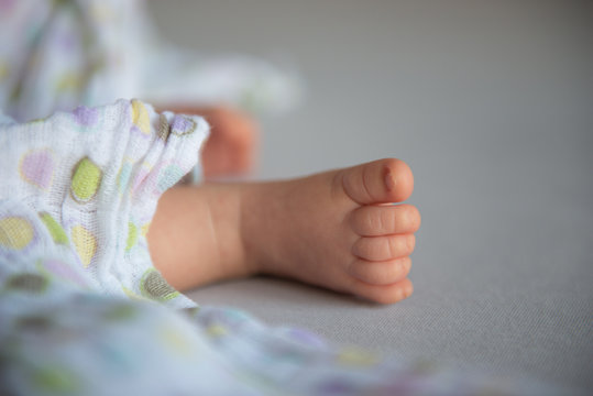 Small cute newborn baby feet