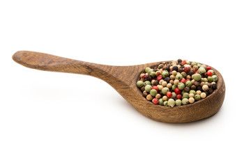 Pepper mix seed on spoon on white background.