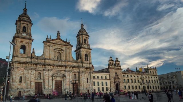 Timelapse of people walking in front of the cathedral of the Immaculate Conception in the Candelaria district, at sunset. The famous landmark is located on the Plaza Bolivar, city center main square.