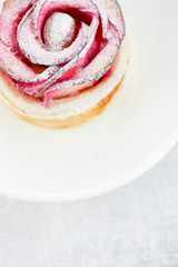 Beautiful apple rose cake coated with powdered sugar