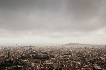 Cloudy view on Barcelona city from the mountain