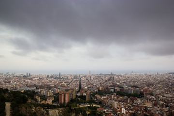 Fototapeta na wymiar Cloudy view on Barcelona city from the mountain