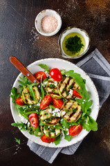 Grilled zucchini with arugula, tomatoes and cottage cheese