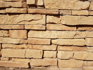 Brown bricks wall with natural stones