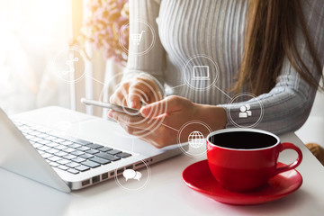 woman is using a mobile phone in the morning.