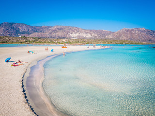 Crete, Greece - Jul 14, 2018: Elafonisi, a paradise beach with turquoise water, an island located close to the southwestern corner of the Mediterranean island of Crete, known for its pink sand beaches
