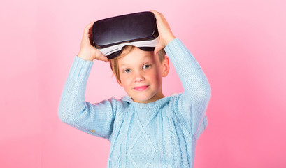 Cyber space and virtual gaming. Virtual reality future technology. Discover virtual reality. Child boy play virtual reality game. Kid boy wear vr glasses pink background. Explore alternative reality