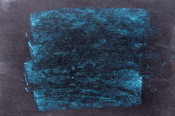 Grunge blue color chalk texture on black board background