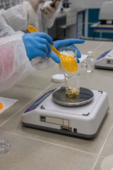 Working process in nanotechnology   laboratory of cosmetic production. Mixing components.
