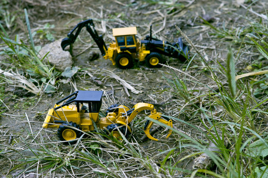 Two excavator cars that organize around to make way.