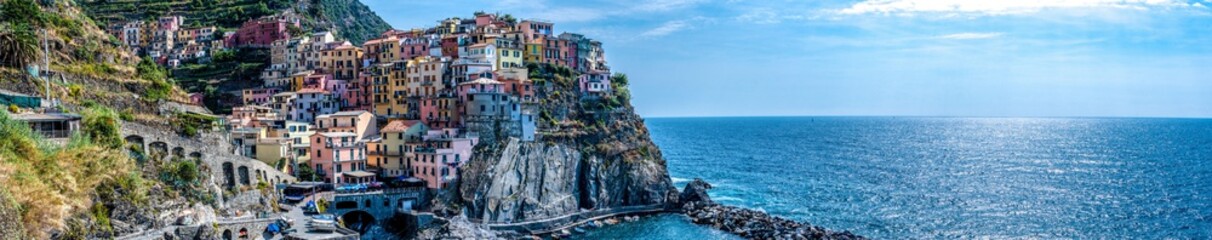 Panoramic view of colorful cityscape on the mountains over Mediterranean sea, Cinque Terre, Italy