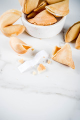Chinese fortune cookie with prediction on white marble background  copy space