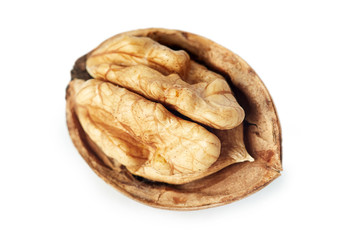 Closeup of single halved walnut isolated on white background