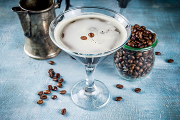 Obraz na płótnie Canvas Coffee drink ideas, espresso martini cocktail, two glasses on blue concrete background copy space