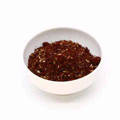 spices for meat and fish in a white ceramic cup, isolated