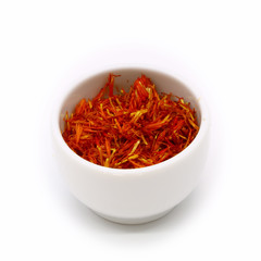 saffron in a ceramic white cup, isolated