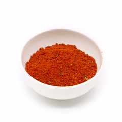 spices for meat and fish in a white ceramic cup, isolated