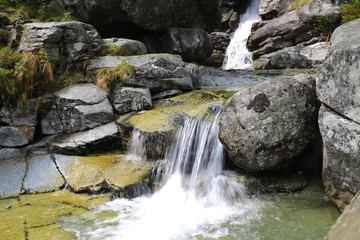 Naklejka na ściany i meble waterfall on mountain stream