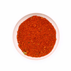 spices for meat and fish in a white ceramic cup, isolated