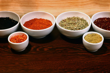 different spices in a white ceramic cup