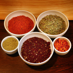 different spices in a white ceramic cup