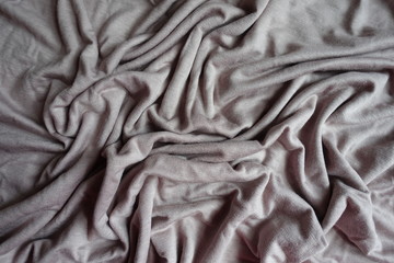 Simple grey viscose fabric in soft folds from above