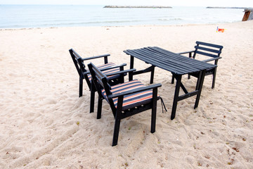 Dining table and chairs on the beach