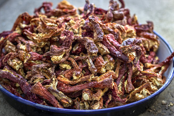 Close-up shoot for dried red chili peppers on the metal plate
