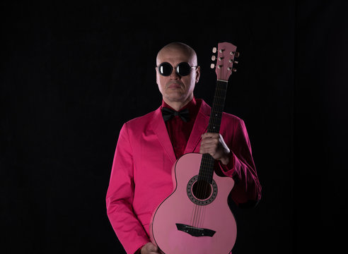 red man with red guitar
