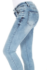 Woman's legs with blue denim on white background