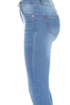Woman's legs with blue denim on white background