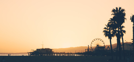 Santa Monica beach and pier at sunset - obrazy, fototapety, plakaty