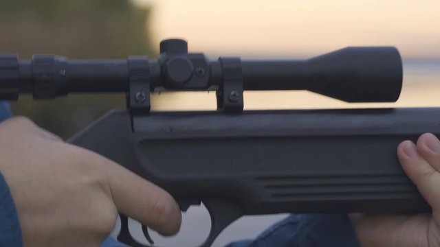 stock footage hunter with rifle with telescopic sight