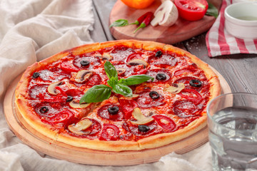 Delicious fresh pizza served on wooden table