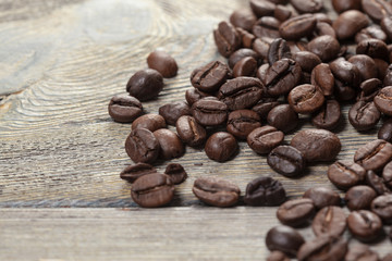 Coffee beans on wood background