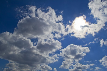 Naklejka na ściany i meble Cumulonimbus clouds with sun