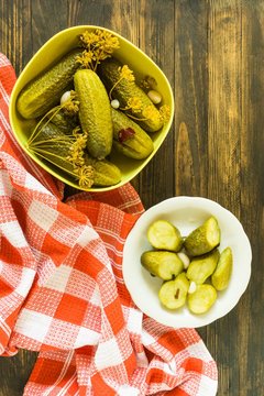 pickled cucumbers gherkins on a wooden table