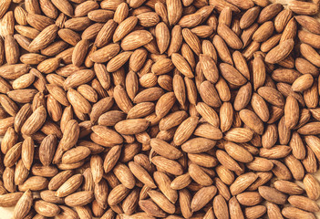 Natural background with almonds, top view