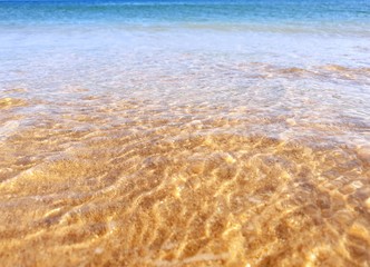 Sea water rushing through Porto de Mós beach, Lagos, Portugal