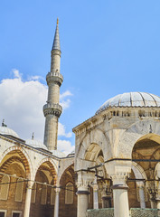 Principal entry to the Arcaded courtyard of The Sultan Ahmet Camii Mosque, also known as The Blue Mosque, with a minaret in the background. Istanbul, Turkey. © Álvaro Germán Vilela