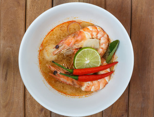 Tom Yum Goong Spicy Sour Soup,Thai  food on wooden table top view